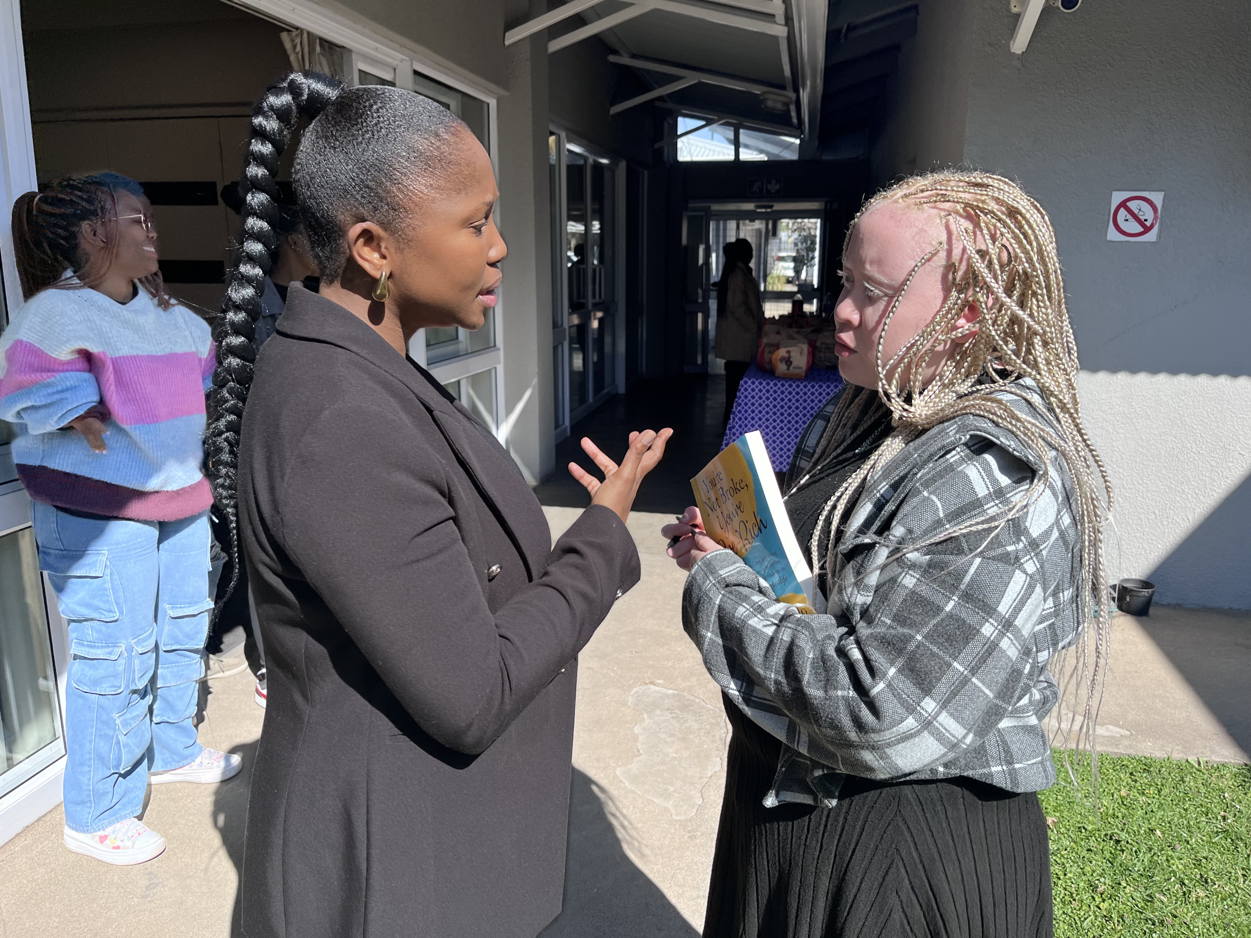 Lallie Kibido chats to facilitator Mapalo Makhu after the financial literacy training